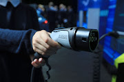 A Phoenix Contact electric vehicle charging plug on show at Ford's exhibition stand during the Frankfurt motor show in Germany on Wednesday.