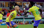 Brazil's Richarlison celebrates with Vinicius during the World Cup last-16 match against Korea Republic at Stadium 974 in Doha Qatar on December 5 2022.