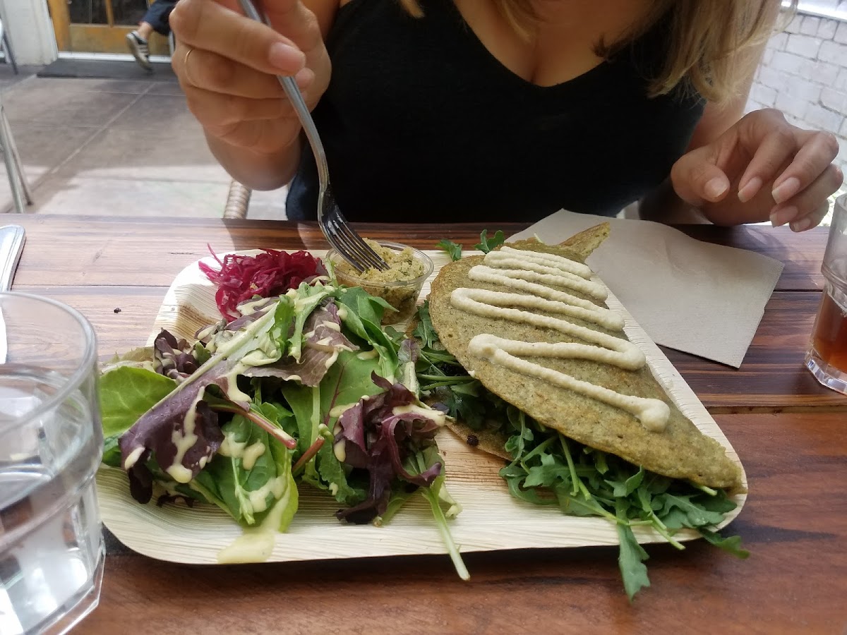 Dosa with butternut squash and goat cheese, side salad, and pickled onions.