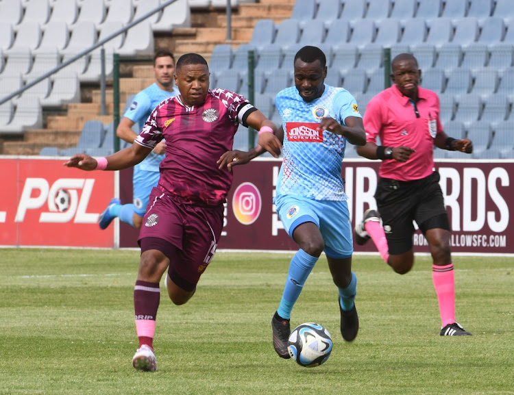 Moroka Swallows' Andile Jali challenges Gamphani Lungu of SuperSport United during the DStv Premiership match at Dobsonville Stadium on Friday.