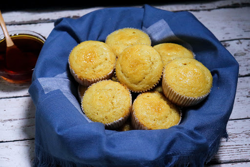 A basket of Honey Cornbread Muffins.