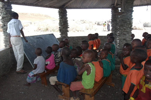 Children in a class session in the only school in the village. Photo/FILE