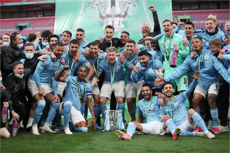 Manchester City players celebrate after winning the Carabao Cup against Tottenham Hotspur