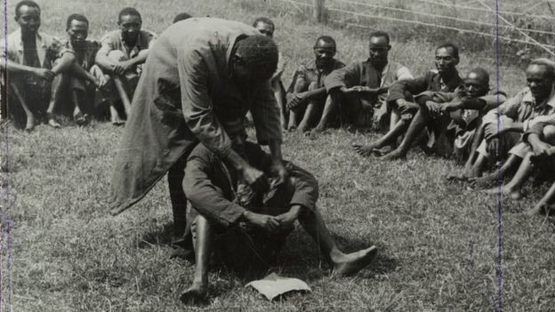 BRIDGEMAN IMAGES The British authorities conducted "de-oathing" ceremonies to persuade Mau Mau suspects to renounce the struggle