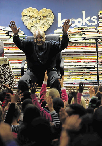 NOBEL EFFORT: Archbishop emeritus Desmond Tutu reading to children from his new book 'Let There Be Light' at Cape Town Central Library