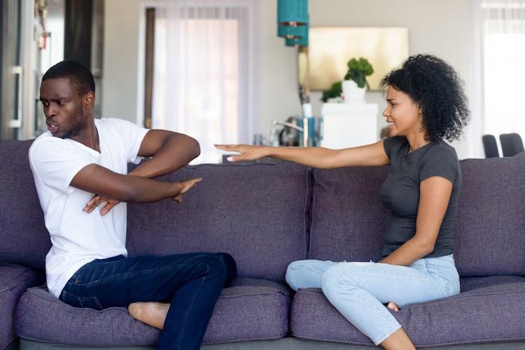 Stock Photo - spouses quarrelling sitting on couch at home,