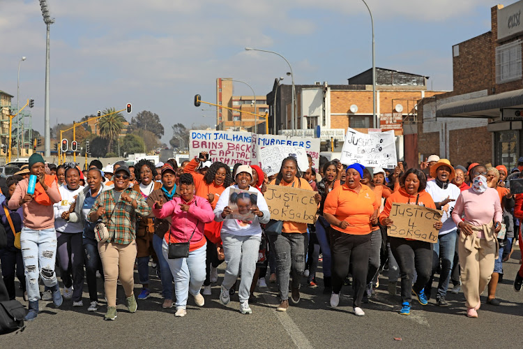 The community has rallied around Bokgabo Poo's family as they seek justice after her murder. Marchers wore orange, the little girl's favourite colour.