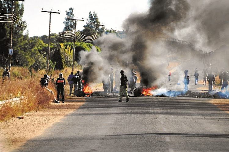 Umzimkhulu in KwaZulu-Natal was closed last week as residents burnt tyres in protest against the lack of basic services. Picture: SOWETAN