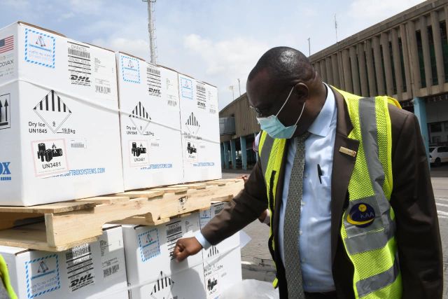 Vaccines deployment taskforce chairperson Willis Akhwale receives an additional 1.36 million doses of Pfizer from the US government at JKIA on January 24, 2022