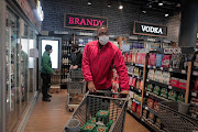 People stock up on their favorite drinks at the Pick n Pay north of Johannesburg as the country enters alert Level 3 of the lockdown. 