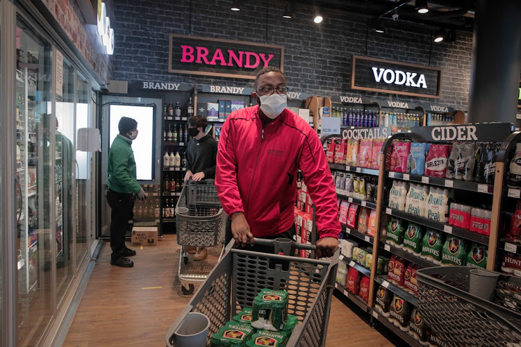 People stock up on their favorite drinks at the Pick n Pay north of Johannesburg as the country enters alert Level 3 of the lockdown.