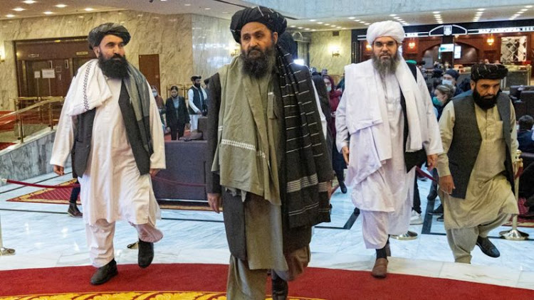 Mullah Baradar (katikati) alikuwa miongoni mwa wanaume wanne walioanzisha Afghan Taliban