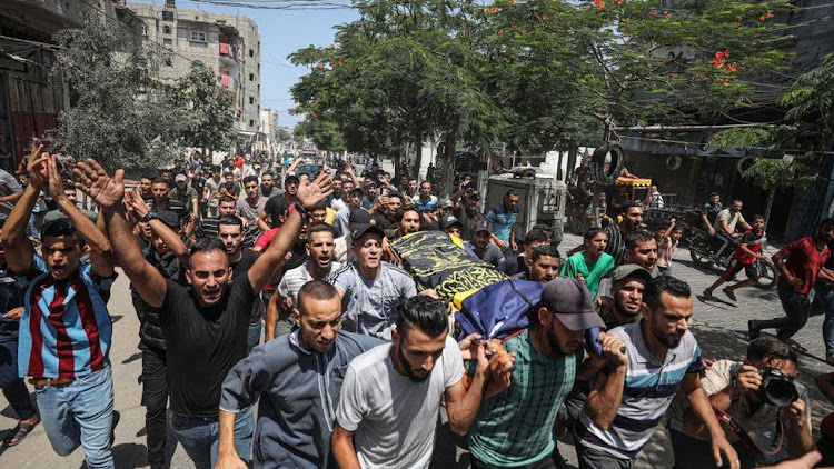 People attend the funeral ceremony of Palestinians, who lost their lives in Israel's attacks, in Rafah, Gaza on August 07, 2022.