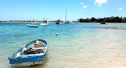 The ocean was a few metres away from the hotel. The permanent residents keep their boats in the water.