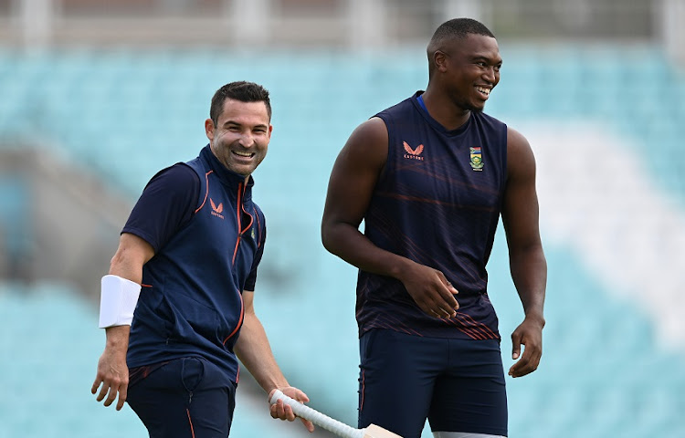 SA captain Dean Elgar and fast bowler Lungi Ngidi share a joke during a nets session at the Oval in London on September 6 2022.