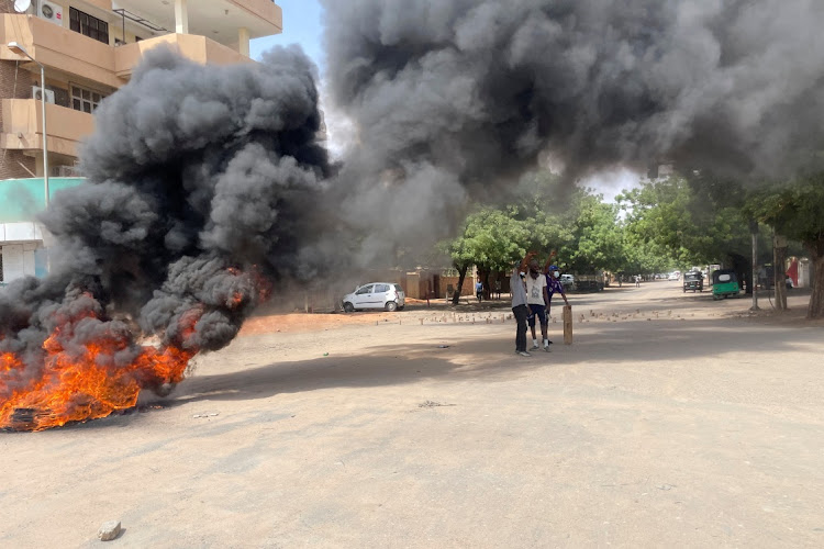 Smoke rises from burning tires during a rally against the country's military leadership, in the capital Khartoum, Sudan July 17, 2022.