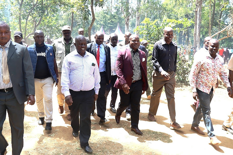 Kakamega Governor Fernandes Barasa (in maroon coat) arrives at the funeral of Mzee Arnold Rapando at Khabondi village in Mumias East subcounty on Wednesday, January 18, 2023.