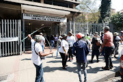 Operation Dudula members protesting outside the Hillbrow Community Care Health Centre yesterday.