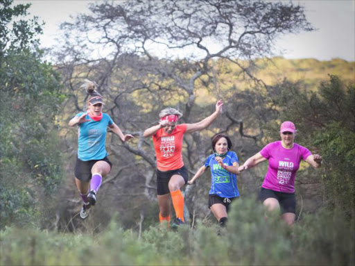 THE JOY RUN: Exuberant photographs like this one of women who participate in the annual Wild Women on the Run up the Wild Coast will make up a calendar which will be launched next week in aid of African Angels School and the Busfare Babies Birth Centre Picture: ANNIE KOCH