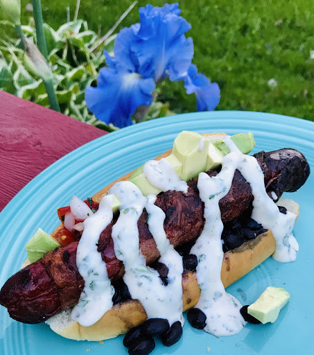 Sonoran hotdog wrapped in bacon and served with black beans, pico de gallo, avocado and Zesty Mayo.