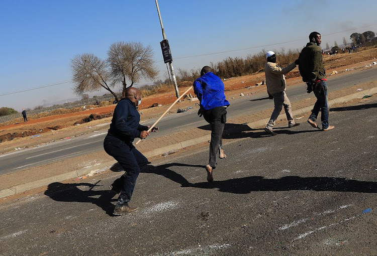 Members of the Katlehong Peoples Taxi Association kept looters at bay.