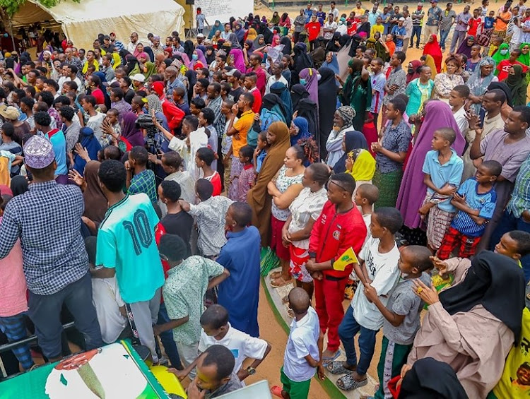 Residents of Bula sheikh in Galbet ward listen to Garissa Township MP Aden Duale during a political rally on Tuesday, August 2.