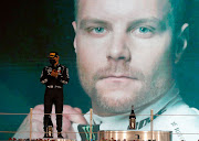 Second placed Valtteri Bottas of Finland and Mercedes GP stands on the podium during the F1 Grand Prix of Abu Dhabi at Yas Marina Circuit on December 13 2020 in Abu Dhabi, United Arab Emirates.