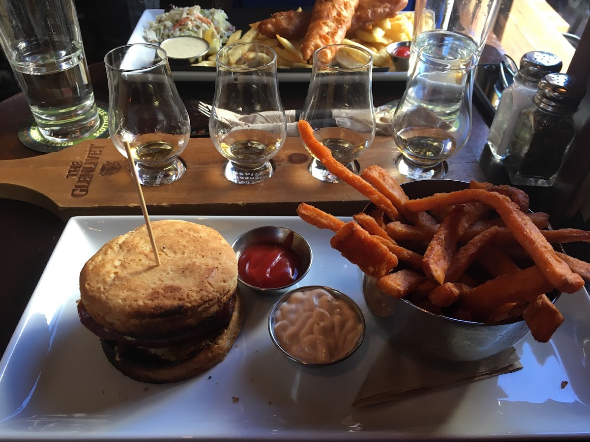 Sausage sandwich with gluten free bun and yam fries