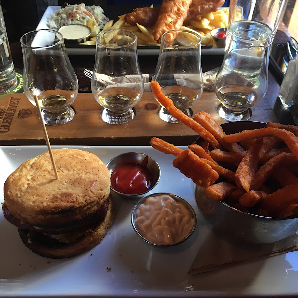 Sausage sandwich with gluten free bun and yam fries