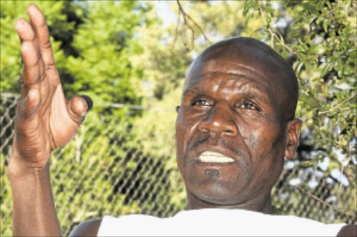 PENSIVE MOOD: Themba Mpongolwane, a rock drill operator, talks about his plight at Implats Mine in Rustenburg, North West. He is one of the miners who have not been paid since January. PHOTO: BAFANA MAHLANGU