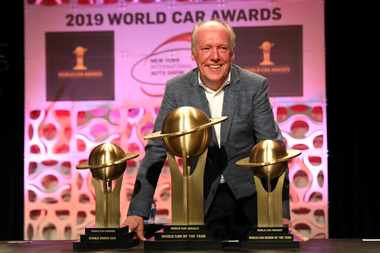 Jaguar's design director Ian Callum accepts the awards at the New York International Auto Show.