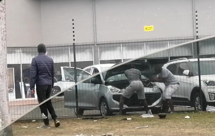 Two men steal a battery from a dealership