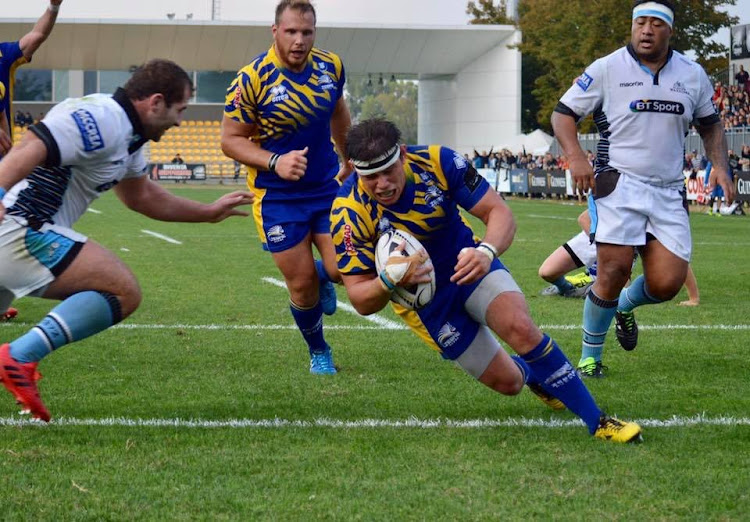 Zebre players scores a try.