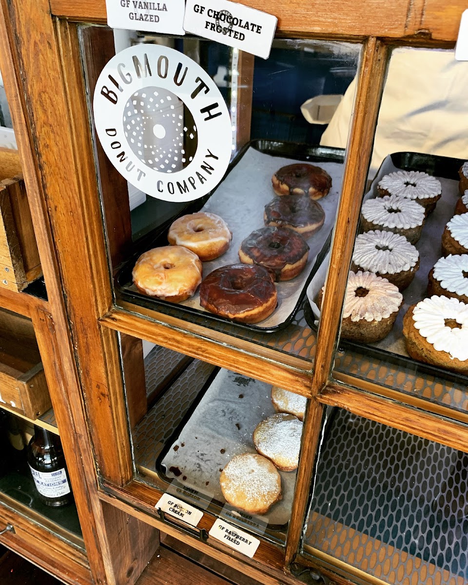 Gluten free vanilla glazed, chocolate glazed, and raspberry filled donuts