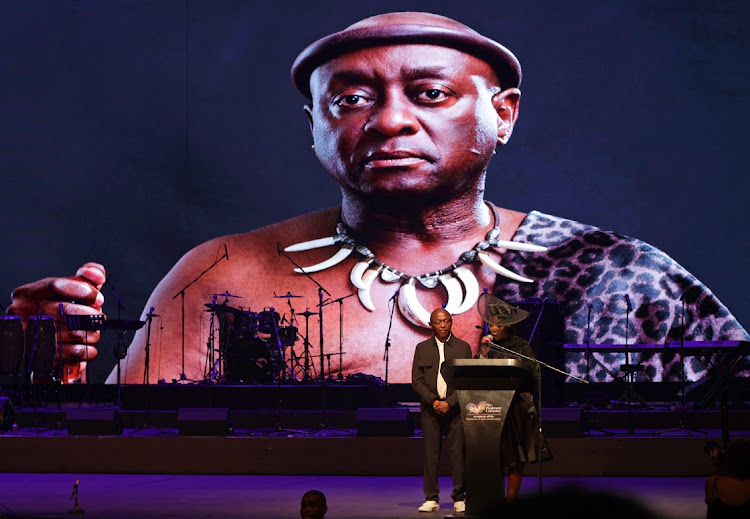 Nhlanhla Ngema and his wife pay his tribute to his brother Mbongeni Ngema during a memorial service at the Playhouse in Durban.