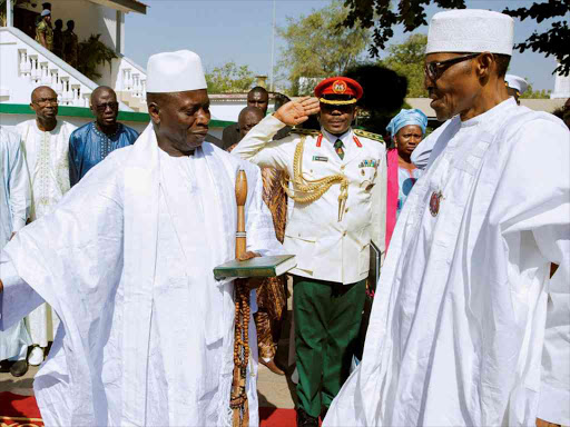 Gambia's President Yahya Jammeh welcomes Nigeria's President Muhammadu Buhari in Banjul, Gambia, January 13, 2017. /REUTERS