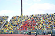 Supporters sing and dance during the CAF Champions League match between Mamelodi Sundowns and Al Ahly at Lucas Moripe Stadium on April 06, 2019 in Pretoria, South Africa.