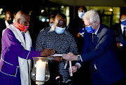 President Cyril Ramaphosa lit a candle to honour health-care workers in SA, many of whom have succumbed to Covid-19, as health minister Zweli Mkhize revealed that positive cases had breached the 18,000 mark in a single day.