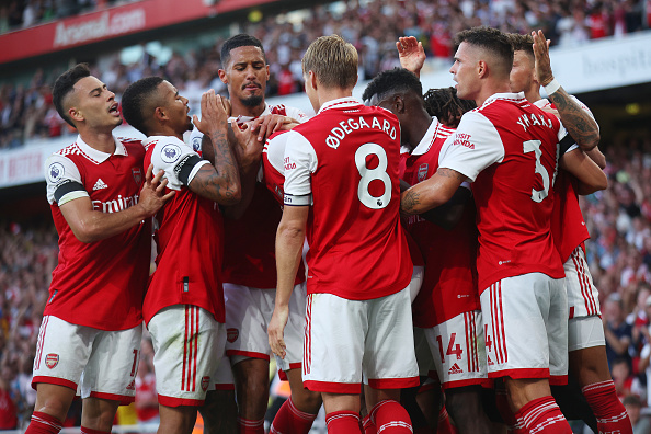 Gabriel Magalhaes of Arsenal celebrates their sides winning goal with team mates during the Premier League match against Fulham FC at Emirates Stadium on August 27, 2022 in London, England.