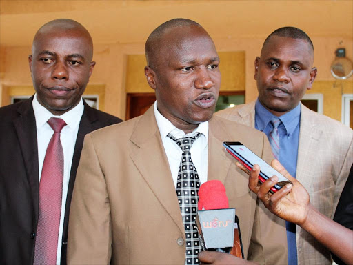 Mwanganthia MCA Julius Mbijiwe address journalists as, Assembly majority leader Victor Karithi and Ntunene MCA Jediel Mauta looks on