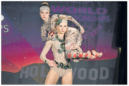 GRAND CHAMPIONS: Merrifield’s Chace Collett and Jemima Kruger perform at the 19th World Championship of Performing Arts in Los Angeles. They won the grand champion junior performers of the world, and junior grand champion of the world for group dance titles Pictures: FACEBOOK