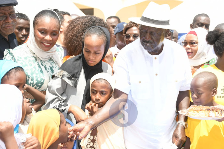 Azimio Leader Raila Odinga sharing cake with kids during celebrations of his 79th birthday in Malindi on Saturday, December 7, 2024.