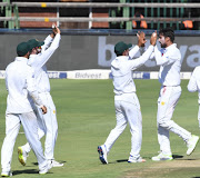 Mohammad Amir of Pakistan celebrate the wicket of Zubayr Hamza of the Proteas with his team mates during day 1 of the 3rd Castle Lager Test match between South Africa and Pakistan at Bidvest Wanderers Stadium on January 11 2018 