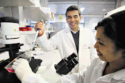 Professor David Fisher helps honours student Fanechka Esterhuysen at the medical bioscience lab at the University of the Western Cape Picture: SHELLEY CHRISTIANS