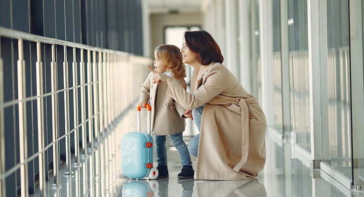 Child and adult going on holiday