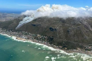 Smoke bellows from the top of a Cape Town mountain which was ablaze on Wednesday. 