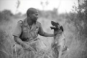 Tracker Bongani Toto and Assegai during a training session at Singita