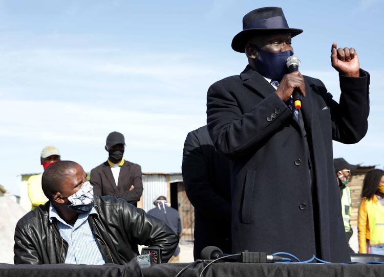 Police minister Bheki Cele with Bulelani Qholani in Khayelitsha on July 4 2020.