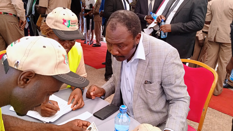 Malava MP Malulu Injendi (Jubilee) being registered for Huduma Namba at Kambi Mwanza in his constituency on April 2