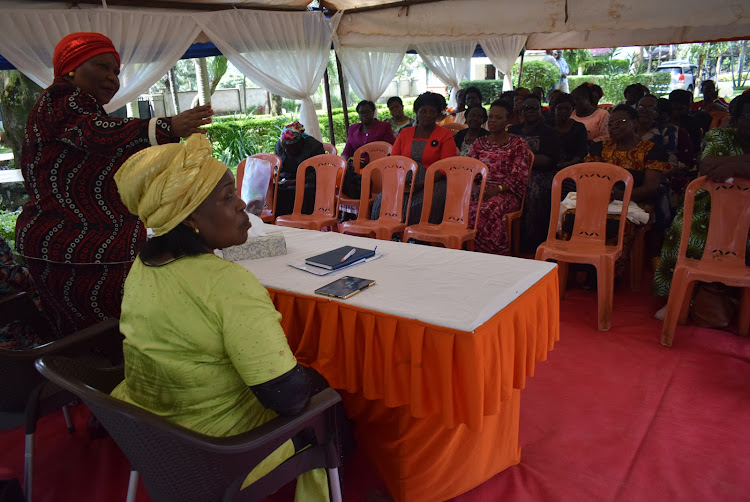 Maendeleo Ya Wanawake chairperson Rahab Muiu speaks to members at Nyamira junction in Kabondo Kasipul constituency on April 30,2024